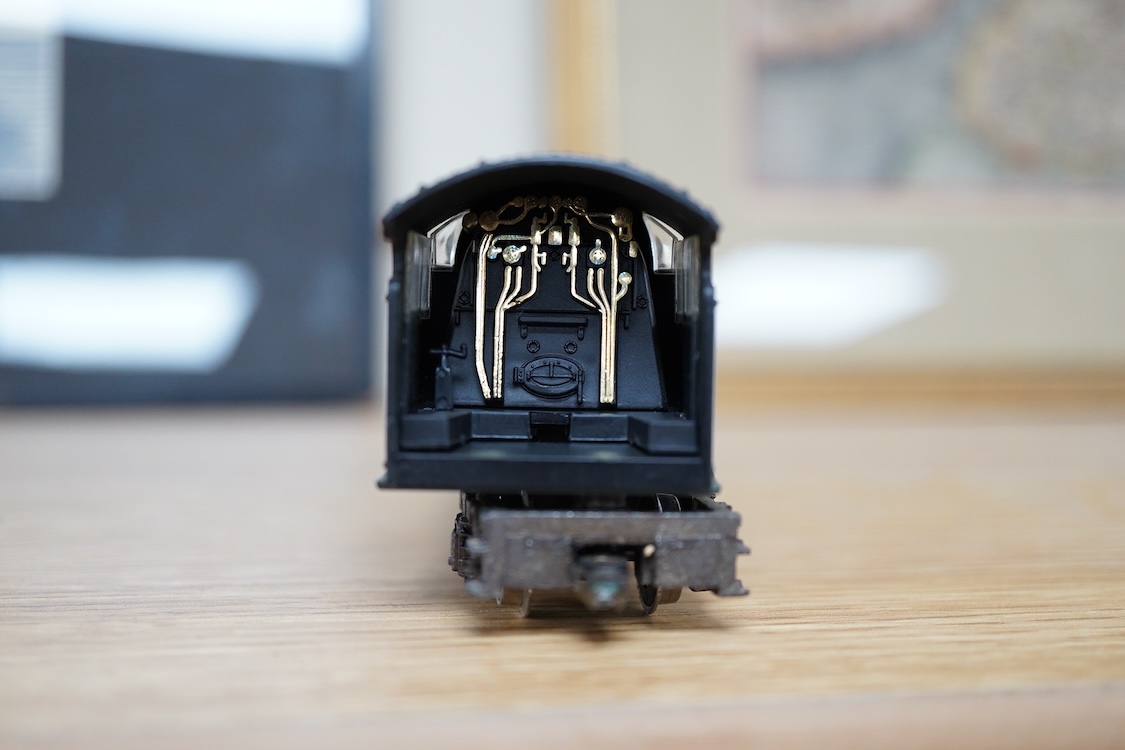 A quantity of 00 gauge model railway by Hornby, Tri-ang, etc. including nineteen locomotives in BR, GWR, LMS, etc. liveries, together with a boxed electrically operated turntable (R070), a terraced house (R8621) and a ga